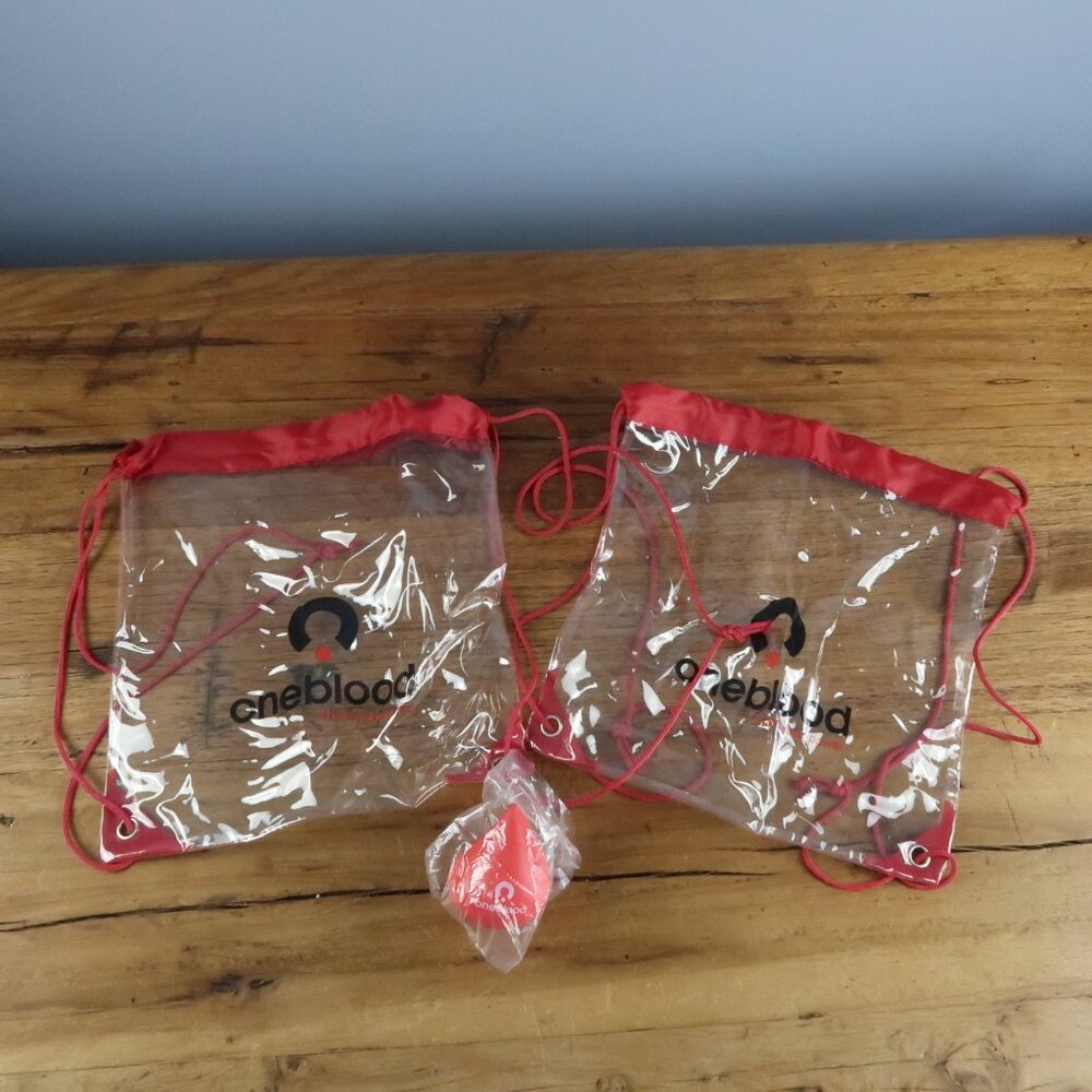 ONEBLOOD CLEAR PLASTIC BACKPACK BUNDLE OF 2 WITH RED STRESS BALL